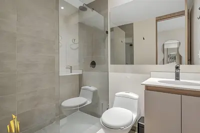 a bathroom with a toilet and a sink at Solei Loft 202 - Chic Studio with AC in El Poblado