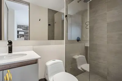 a bathroom with a toilet and a sink and a shower at Solei Loft 301 - Location/Trendy Jacuzzi Living in El Poblado