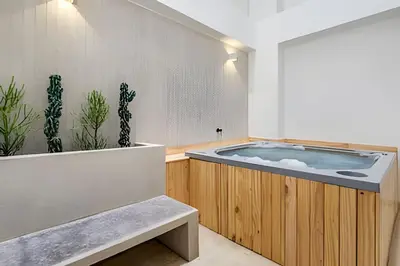 a bathroom with a jacuzzi tub in a room at Solei Loft 302 - Elegant Oasis: Loft/Jacuzzi/AC in El Poblado