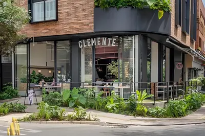 a store front of a restaurant with tables and plants at Solei Loft 401 - Elegance & Comfort /AC in Poblado in El Poblado
