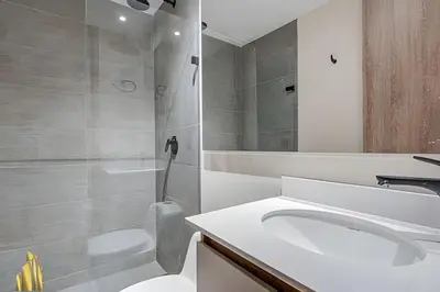 a bathroom with a sink and a toilet and a shower at Solei Loft 402 - Espacious & bright apt with AC in El Poblado