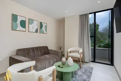 a living room with a couch and a table at Solei Loft 402 - Espacious & bright apt with AC in El Poblado