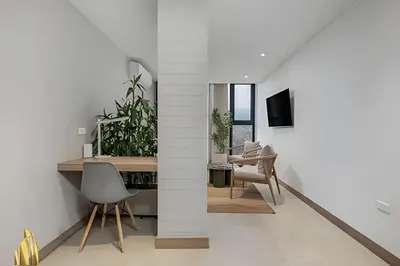 a room with white walls and a desk and chairs at Solei Loft 502 - Calm & cozy in Manila Poblado/AC in El Poblado