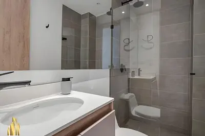 a bathroom with a sink and a toilet and a shower at Solei Loft 502 - Calm & cozy in Manila Poblado/AC in El Poblado