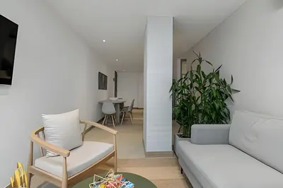 a living room with a couch and a table at Solei Loft 502 - Calm & cozy in Manila Poblado/AC in El Poblado