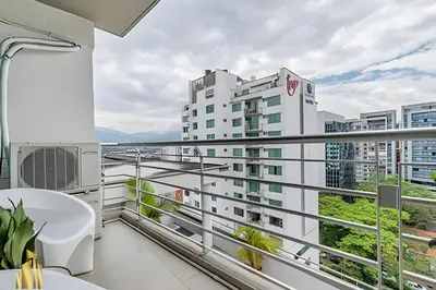 a balcony with a view of a building at Torre 6 Sur - Trendy Loft: Balcony, AC / Poblado in El Poblado