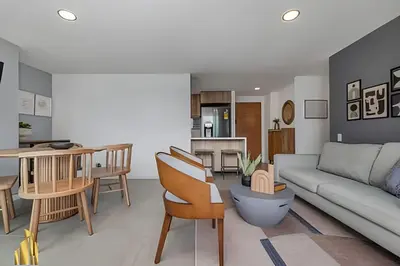 a living room with a couch and a table at Torre 6 Sur - Trendy Loft: Balcony, AC / Poblado in El Poblado