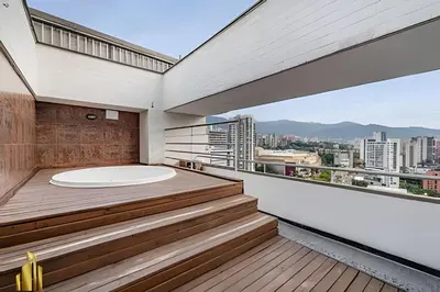 a balcony with a jacuzzi tub on a building at Torre 6 Sur - Trendy Loft: Balcony, AC / Poblado in El Poblado