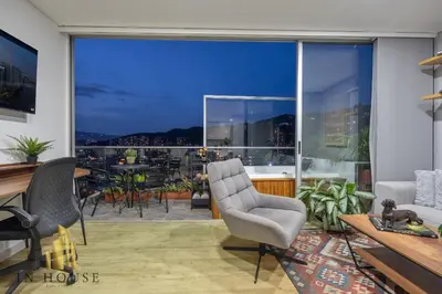 a living room with a view of a city at Urban 2005 - Serenity AC retreat: Soft decoration in El Poblado