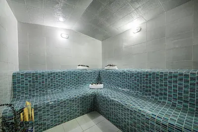 a blue tiled bathroom with two sinks and two lights at Urban 2005 - Serenity AC retreat: Soft decoration in El Poblado