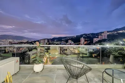 a balcony with a view of a city at Urbano2205-Serenidad y fitness. Apt- piscina/gym in El Poblado