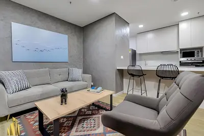 a living room with a couch and a table at Urbano2205-Serenidad y fitness. Apt- piscina/gym in El Poblado