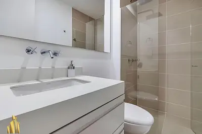 a white bathroom with a sink and a toilet at Urbano2205-Serenidad y fitness. Apt- piscina/gym in El Poblado