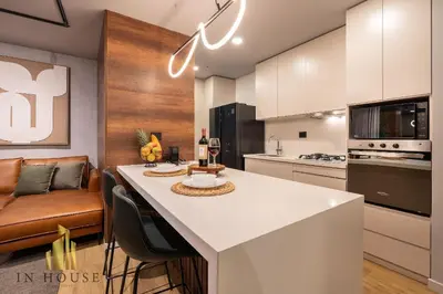 a kitchen with a large white island in a room at Urban 2505 - Oasis with pool and gym in El Poblado