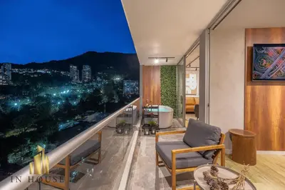 a living room with a view of a city at Urban 2505 - Oasis with pool and gym in El Poblado