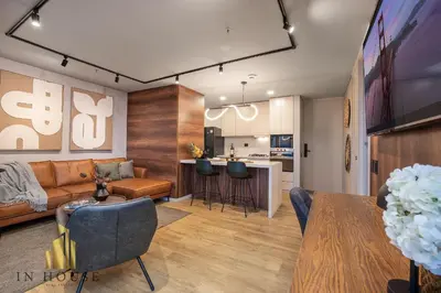 a living room with a couch and a kitchen at Urban 2505 - Oasis with pool and gym in El Poblado