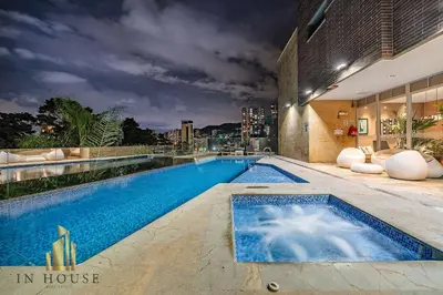 a swimming pool on the side of a building at Urban 701-Apt relajante con piscina, jacuzzi y gym in El Poblado