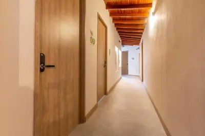 an empty corridor with a door and a corridorngthngthngthngthngthngthngth at Spacious Laureles Apt-SuperHost-AC-WIFI in Medellín