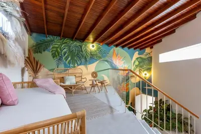 a room with a mural on the wall at Laureles Apt-Eco-Smart Locks-AC-Super Location in Medellín