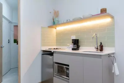 a kitchen with a counter and a sink at Large Apt-Laureles-Smart Lock-AC-Laundry Service in Medellín