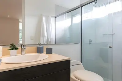 a bathroom with a sink and a shower at Provenza Life 603 - Chic Urban Retreat in El Poblado
