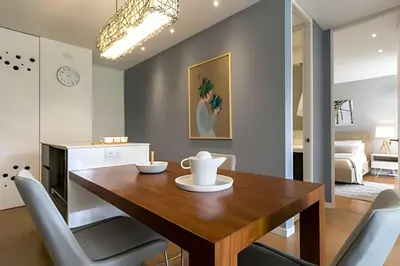 a dining room with a wooden table and chairs at Provenza Life 603 - Chic Urban Retreat in El Poblado