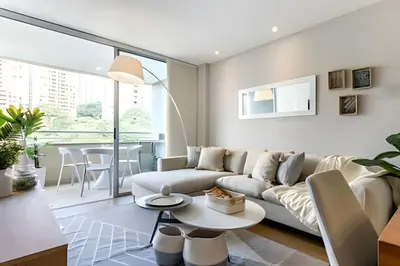a living room with a couch and a table at Provenza Life 603 - Chic Urban Retreat in El Poblado