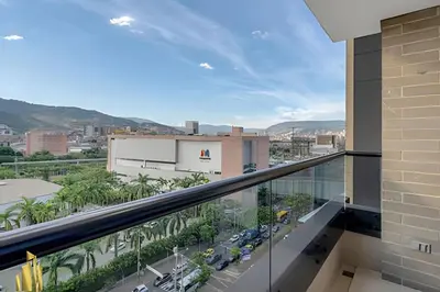 a balcony with a view of a city at Clase 48 apt1002 - Loft with Panoramic Views and AC in Sabaneta