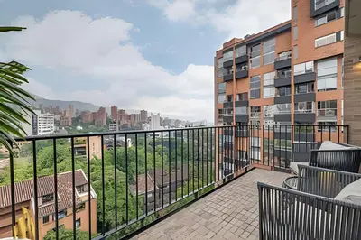 a balcony with a view of a city at C36 apto. 802 - Luminoso Dúplex con Vistas Panorámicas in Medellín