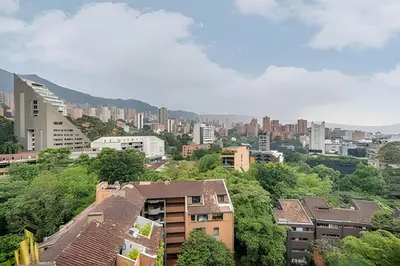 a view of a city with buildings and trees at C36 apto. 802 - Luminoso Dúplex con Vistas Panorámicas in Medellín
