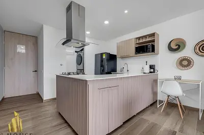 a kitchen with a sink and a counter top at Class 48 apto. 1404 - Vistas modernas de la ciudad / AC in Sabaneta