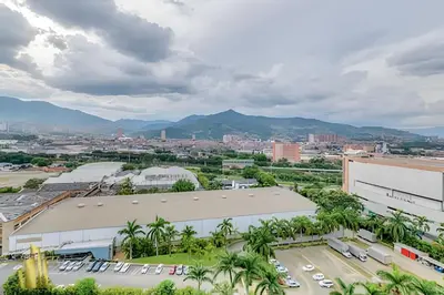 a view of a city with mountains in the background at Class 48 apto. 1404 - Vistas modernas de la ciudad / AC in Sabaneta