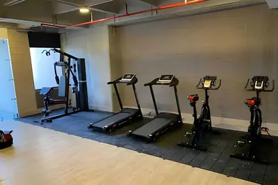 a gym with several tread machines in a room at Class 48 apto. 1503 - Tranquilidad moderna/Balcón priv in Sabaneta