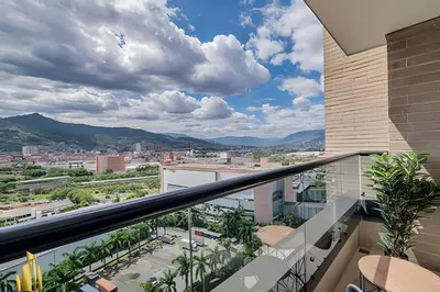 a balcony with a view of a city at Class 48 apto. 1503 - Tranquilidad moderna/Balcón priv in Sabaneta