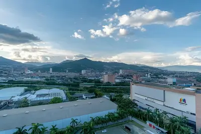 a view of a city with mountains in the background at Class 48 apto. 1603 - Sophisticated apt/panoramic views in Sabaneta