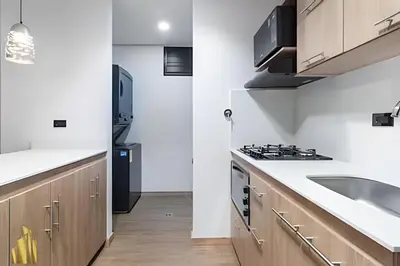 a kitchen with a sink and a stove at Class 48 Apt 2201 - Apt en Sabaneta con balcón privado in Sabaneta