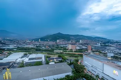a view of a city with mountains in the background at Class 48 Apt 2201 - Apt en Sabaneta con balcón privado in Sabaneta