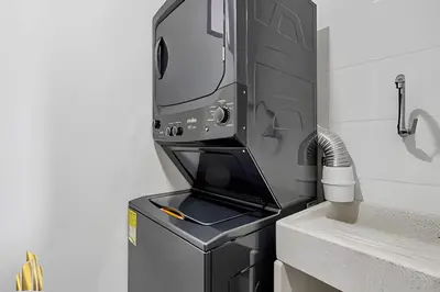 a machine sitting on top of a counter next to a sink at Class 48 Apt. 2202 - Apt luminoso/Balcón/AC in Sabaneta