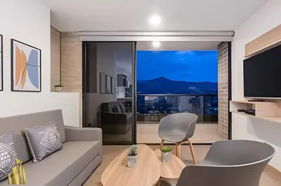 a living room with a couch and a table at Class 48 Apt. 2203 - Apt moderno y acogedor balcón priv in Sabaneta