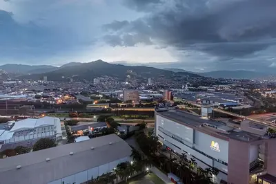 a view of a city with mountains in the background at Class 48 Apt. 2301 - Luces de ciudad/Loft/Balcón priv in Sabaneta