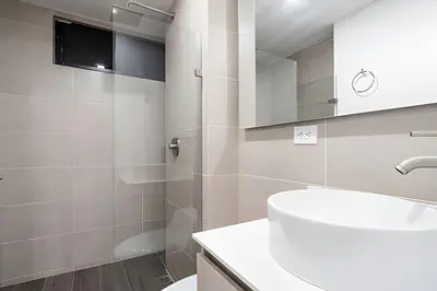 a bathroom with a sink and a shower at Class 48 Apt. 2302 - Íntimo loft con balcón privado in Sabaneta
