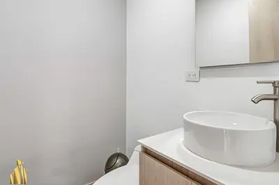a white bathroom with a sink and a toilet at Class 48 Apto. 2501 - Apto tranquilo y luminoso/balcón in Sabaneta