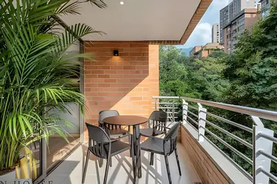 a balcony with a table and chairs on it at La Mannuela 505 - Stylish Living in El Poblado in El Poblado