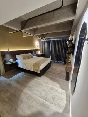 a bedroom with a large bed in a room at Mali Experience in Rionegro