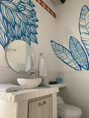 a bathroom with a sink and a mirror on the wall at Hotel Art Boutique Las Cardenas in Carolina del Principe