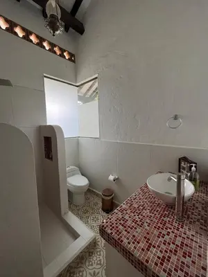 a bathroom with a sink and a toilet at Hotel Art Boutique Las Cardenas in Carolina del Principe