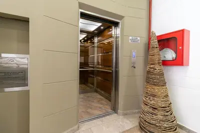 a building with a christmas tree in a hallway at ApartaSuite Central Luxe in Itagüí