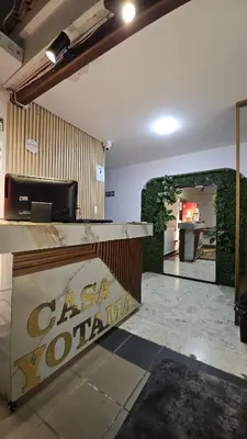 a room with a counter with a sign on it at Hotel casa yotama in Medellín