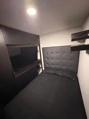 a small bedroom with a bed in a room at Mirador Fiorenza in Medellín
