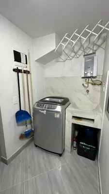 a small kitchen with a counter with a computer on it at Apto estudio moderno en Sabaneta Ideal para pareja in Sabaneta